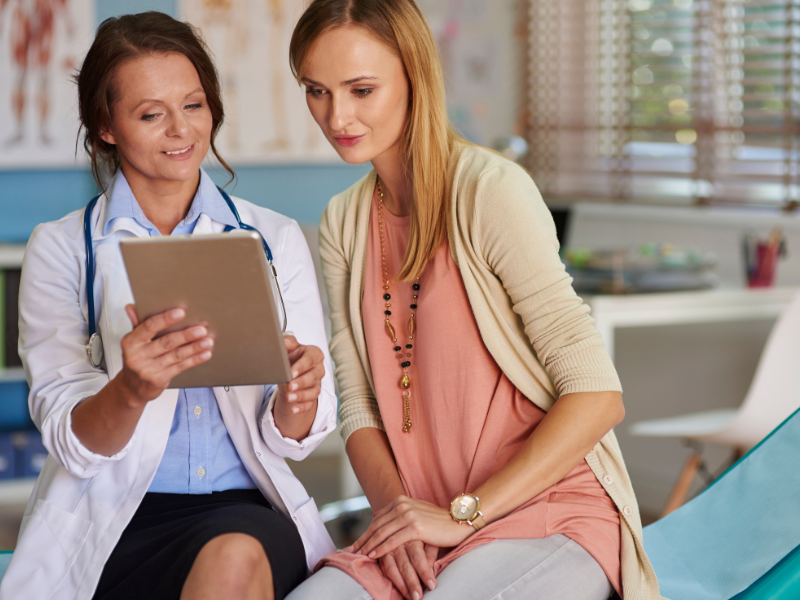 Doctor showing pharmacogenomics chart to patient