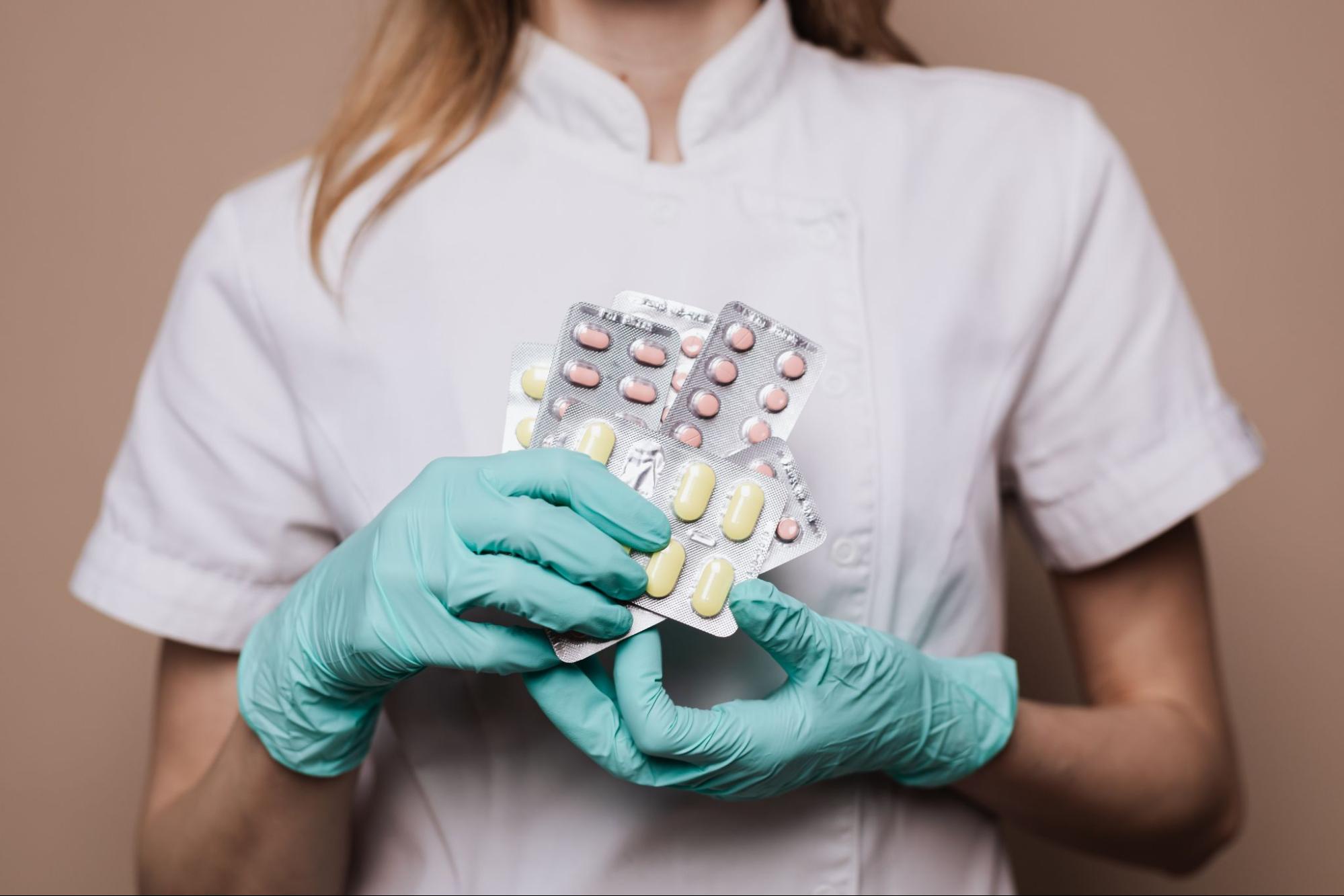 Clinical pharmacist holding medication