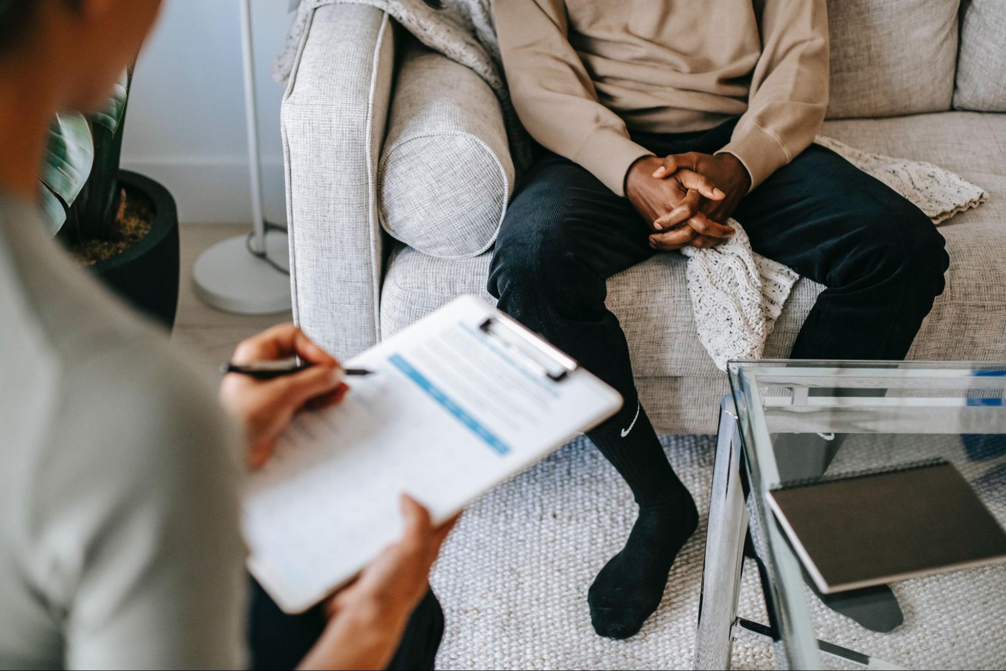 Person sitting during exposure therapy session